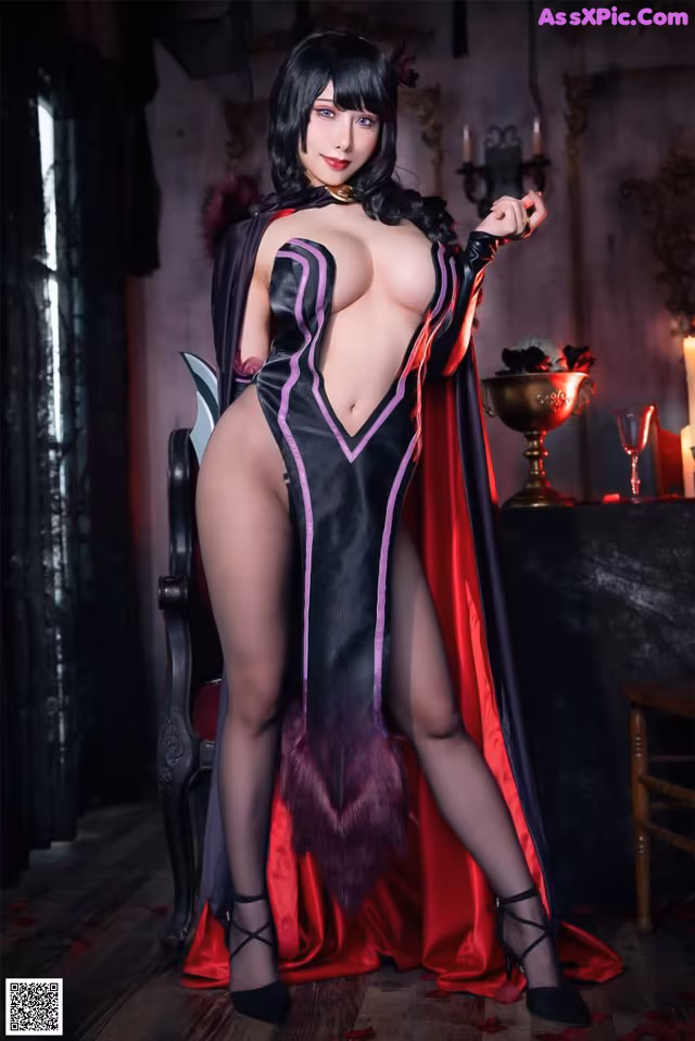 A woman dressed as a vampire posing for a picture.