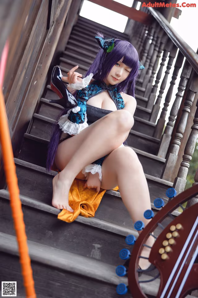 A woman with purple hair sitting on a set of stairs.