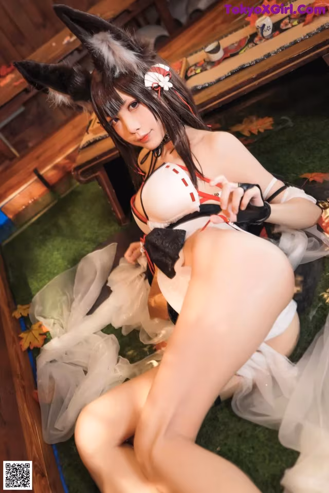 A woman in a bunny costume is posing for the camera.