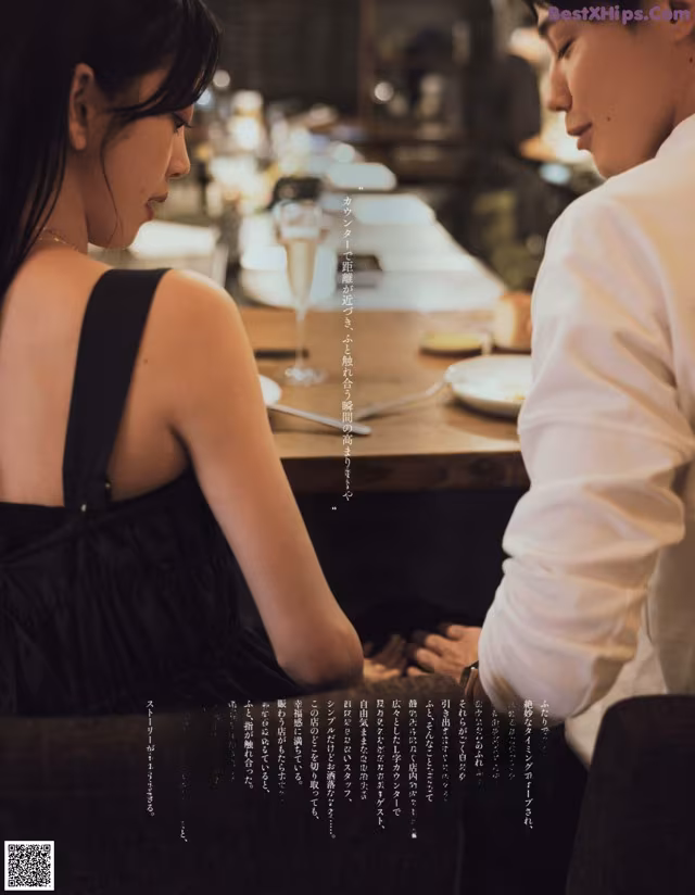 A man and a woman sitting at a table in a restaurant.