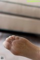 A close up of a person's foot with a pair of socks on.